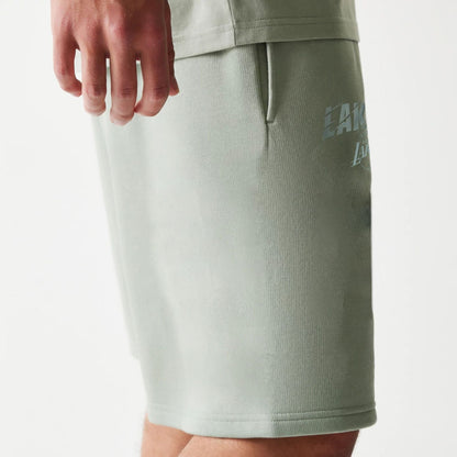 The model is wearing this NBA LA Lakers Shorts in pastel green. 5