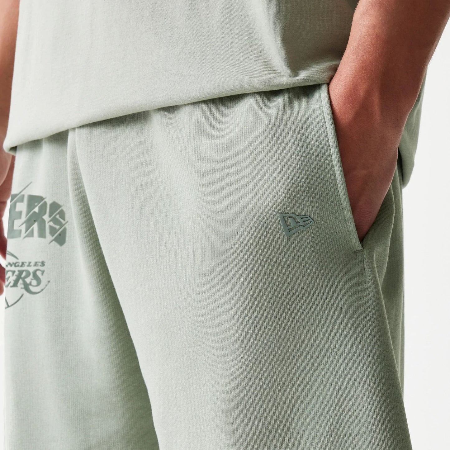 The model is wearing this NBA LA Lakers Shorts in pastel green. 6