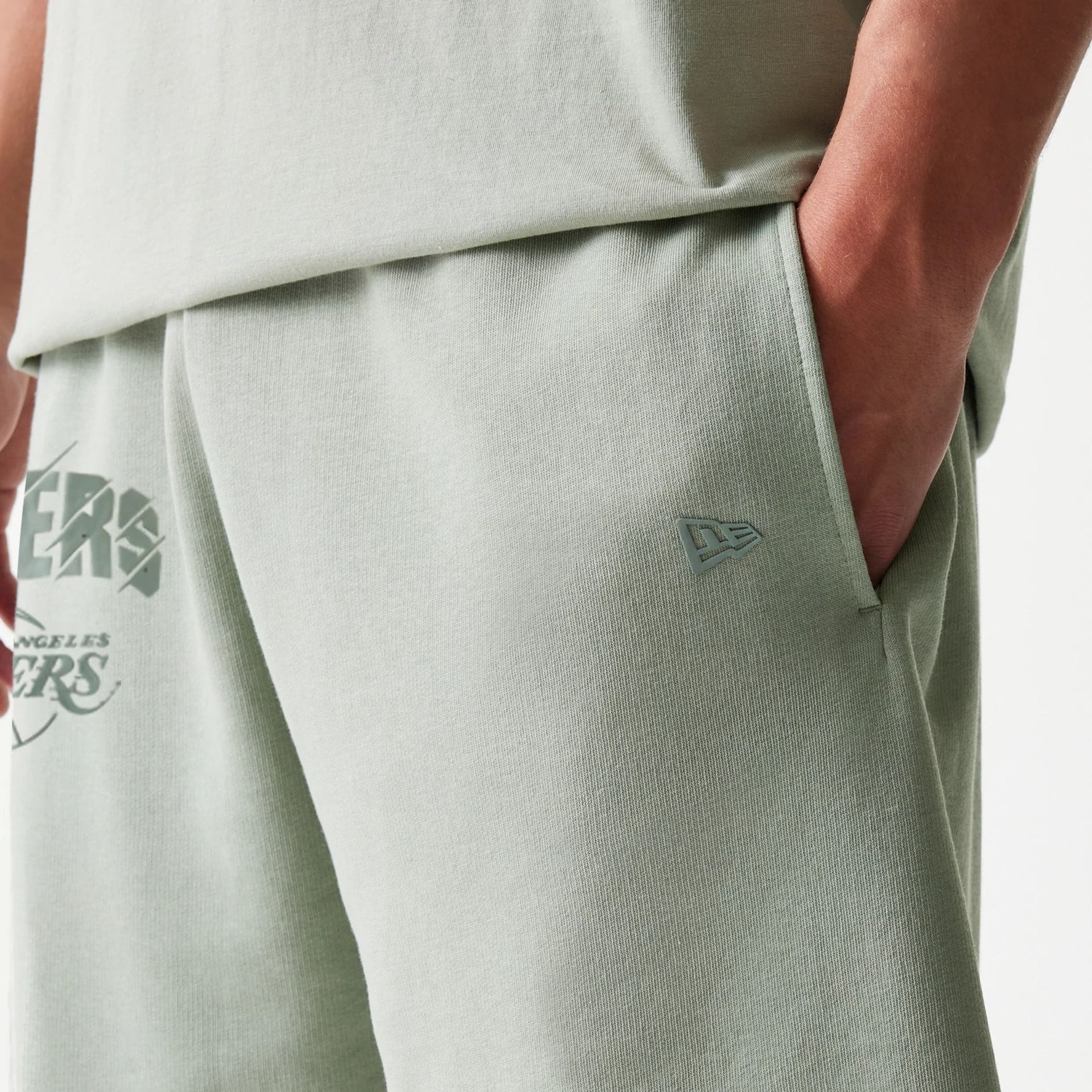 The model is wearing this NBA LA Lakers Shorts in pastel green. 6