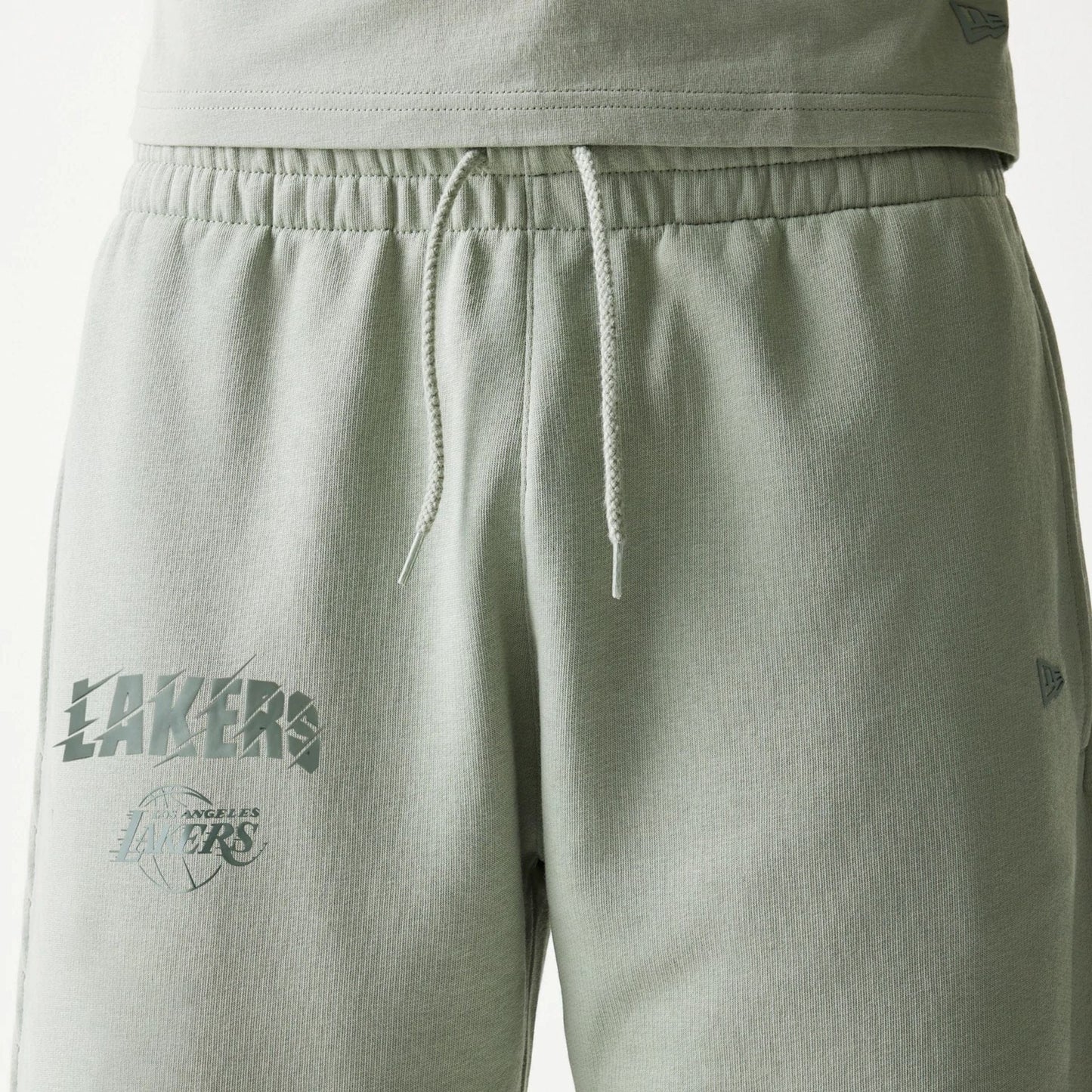 The model is wearing this NBA LA Lakers Shorts in pastel green. 3