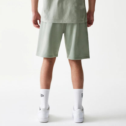 The model is wearing this NBA LA Lakers Shorts in pastel green. 2