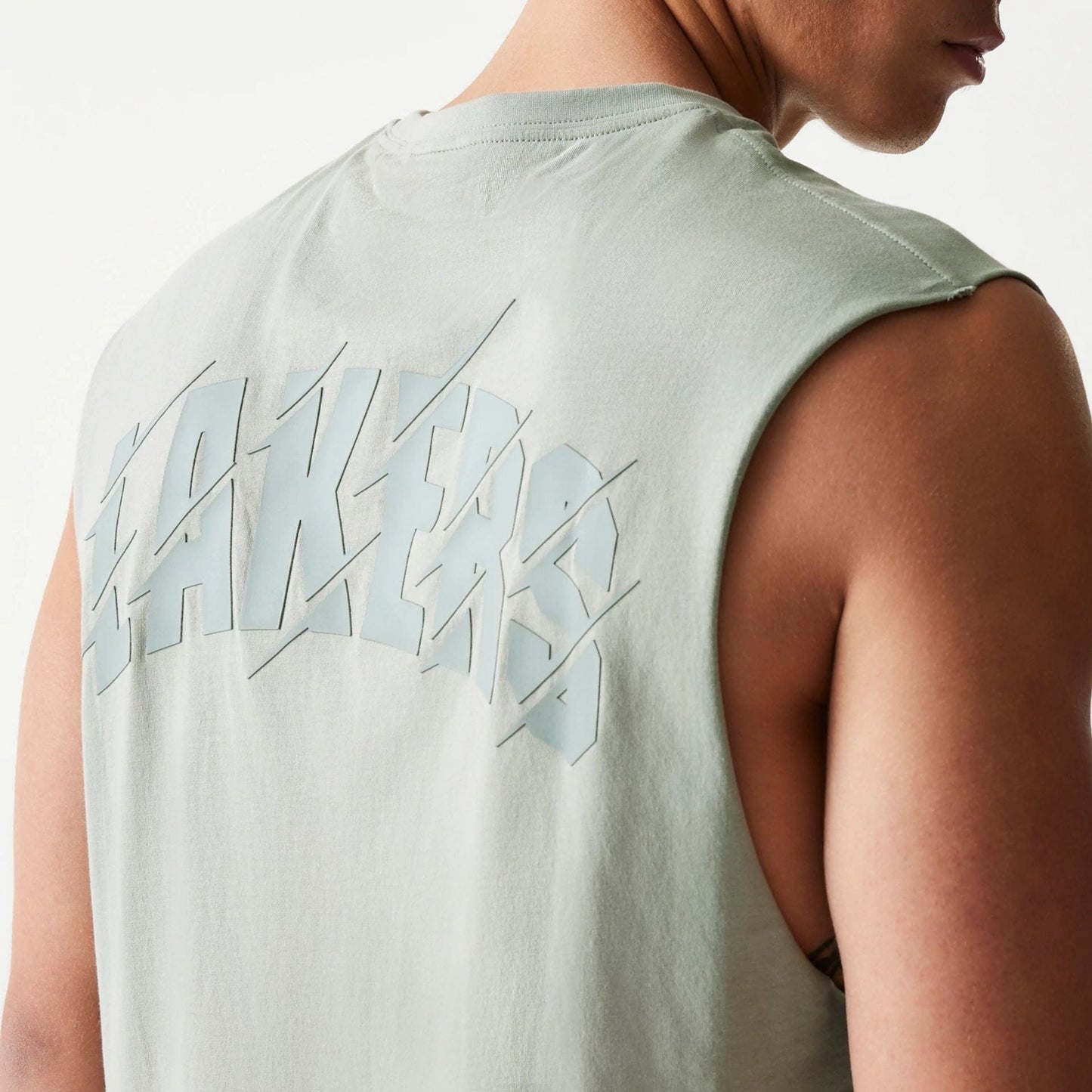 The model is wearing this NBA LA Lakers Sleeveless T-Shirt in pastel green. 6
