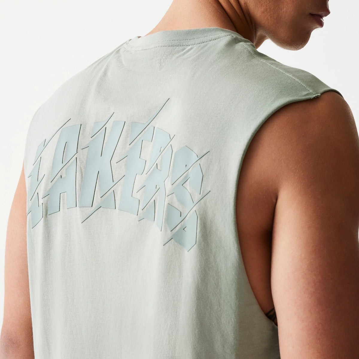 The model is wearing this NBA LA Lakers Sleeveless T-Shirt in pastel green. 6