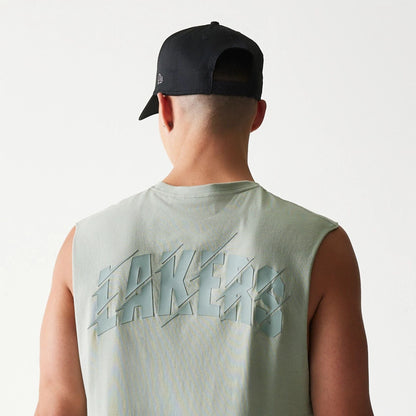 The model is wearing this NBA LA Lakers Sleeveless T-Shirt in pastel green. 7