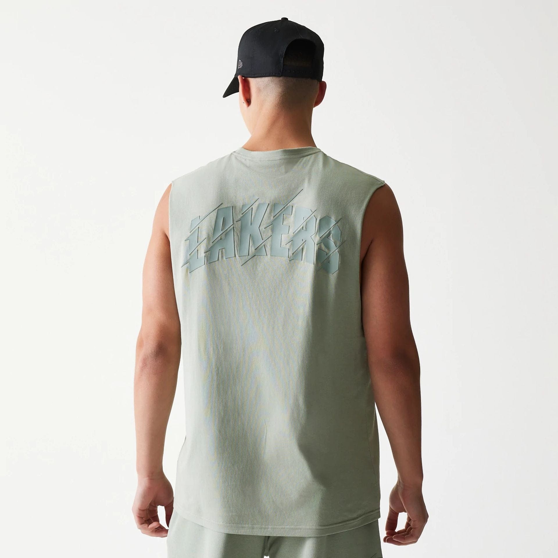 The model is wearing this NBA LA Lakers Sleeveless T-Shirt in pastel green. 2