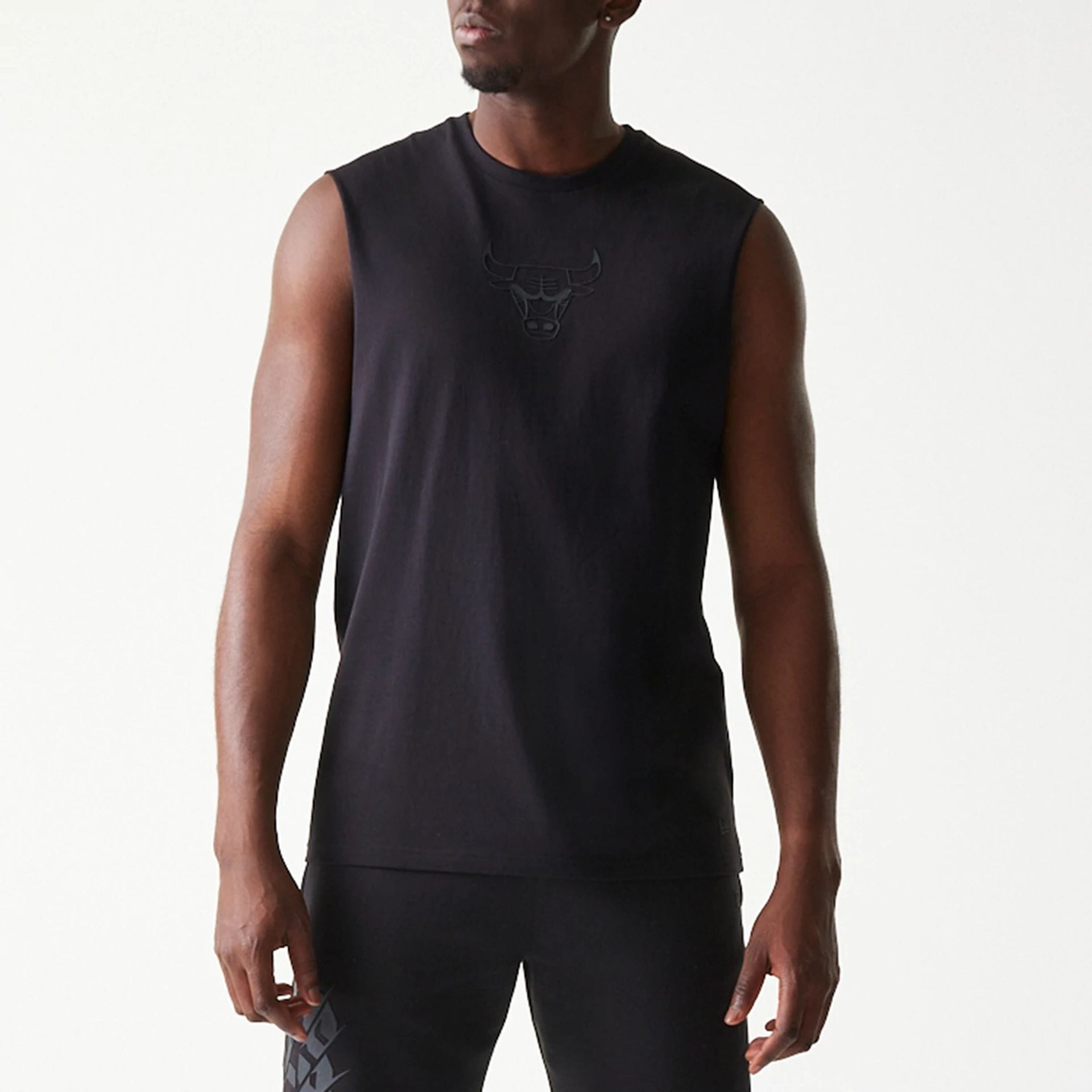 The model is wearing this NBA Chicago Bulls Sleeveless T-Shirt in black. 3