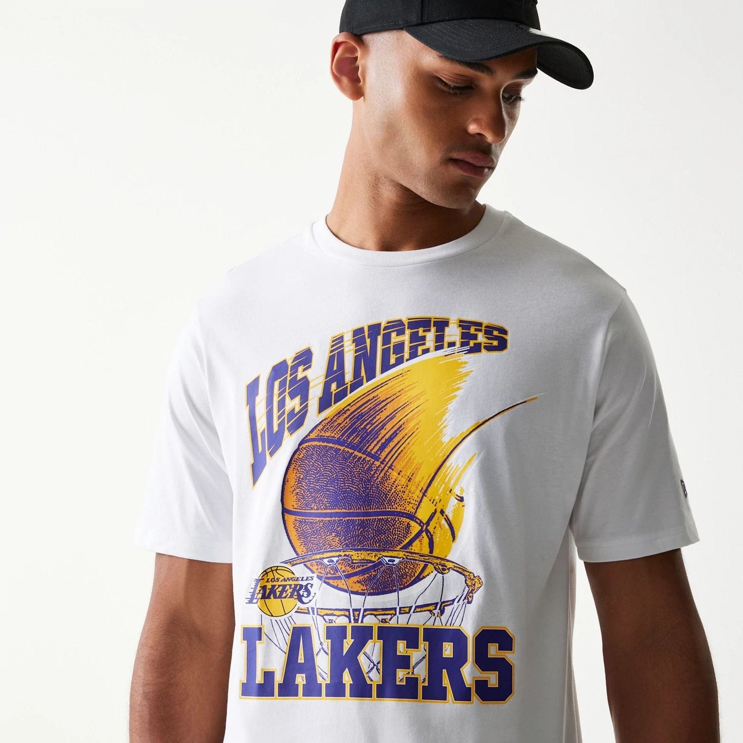 The model is wearing this NBA Ball Graphic LA Lakers T-Shirt in white. 6