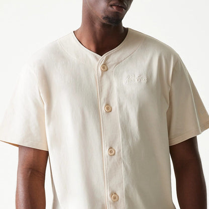 The model is wearing this New Era Script T-Shirt in light beige. 5