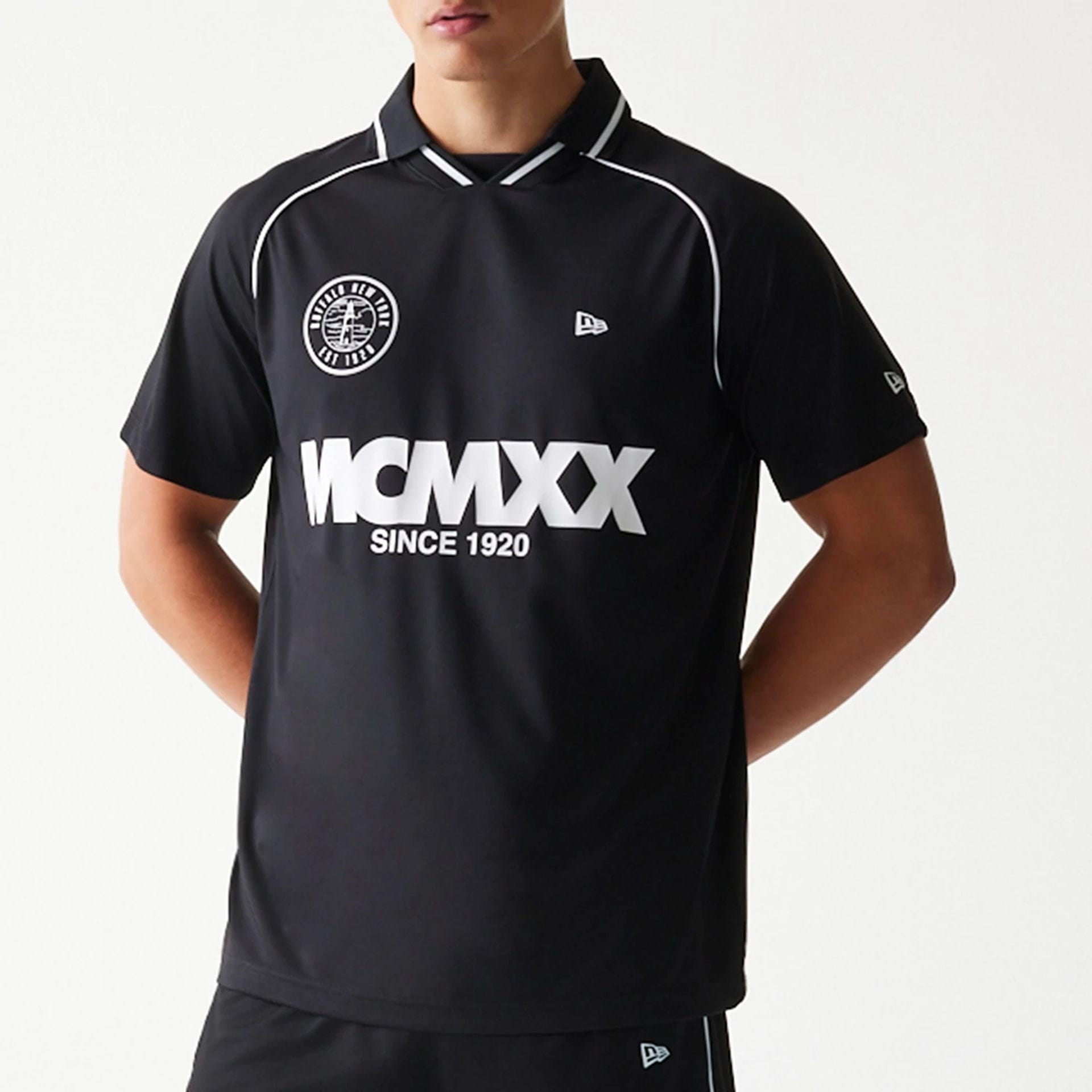 The model is wearing this New Era Football T-Shirt in black. 3