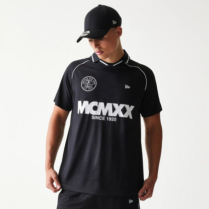 The model is wearing this New Era Football T-Shirt in black. 1