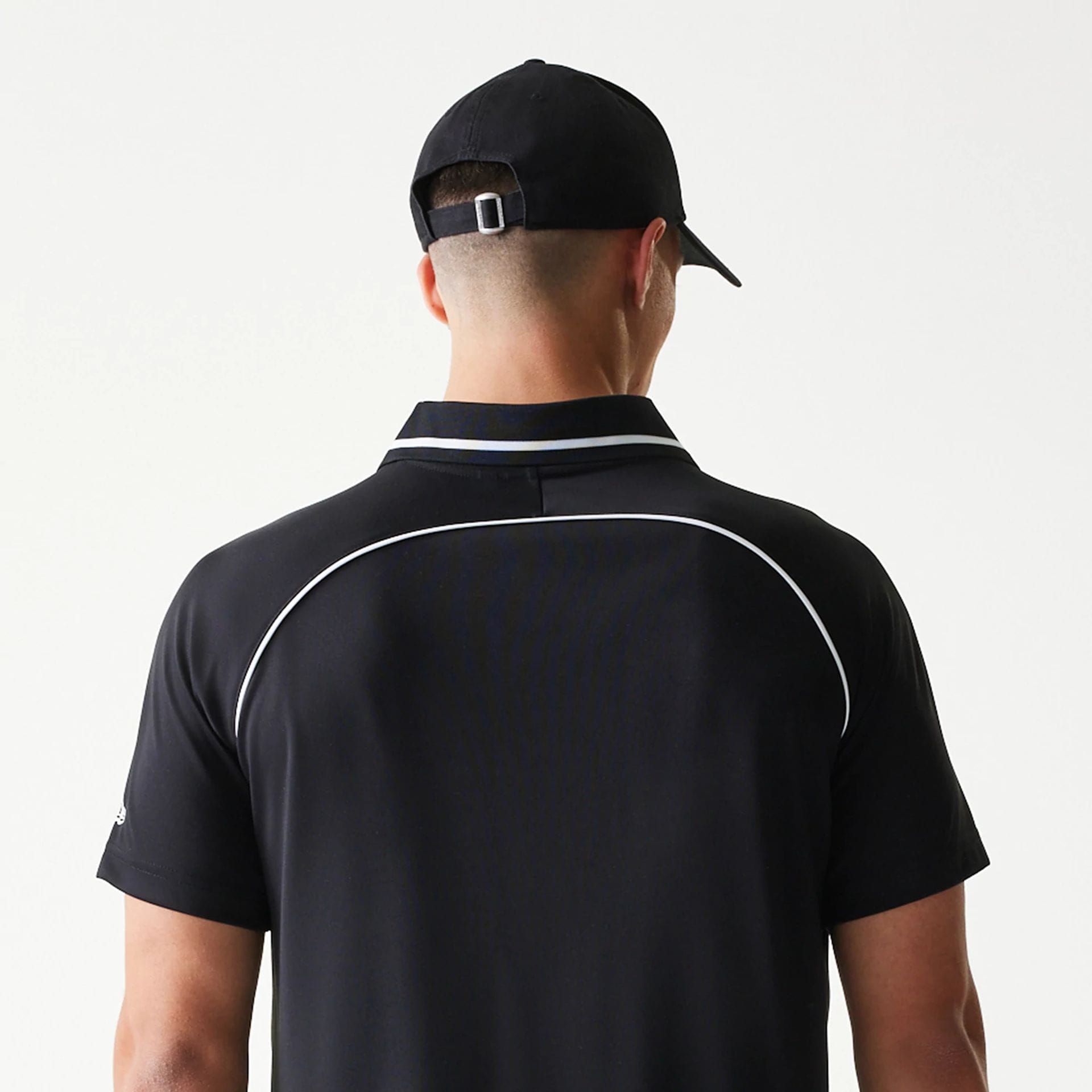 The model is wearing this New Era Football T-Shirt in black. 7