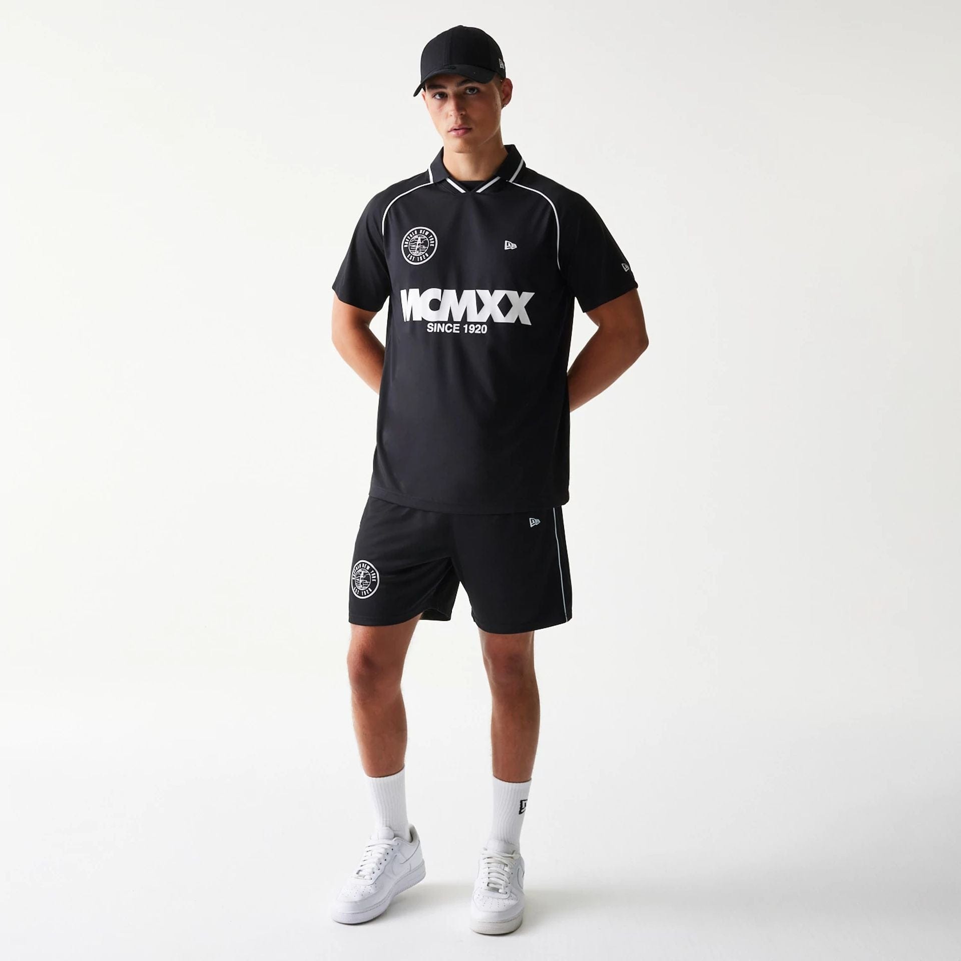 The model is wearing this New Era Football T-Shirt in black. 8