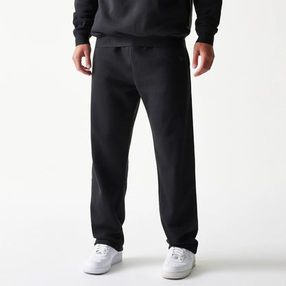 The model is wearing this New Era Tech Straight Leg Joggers in black on black. 4