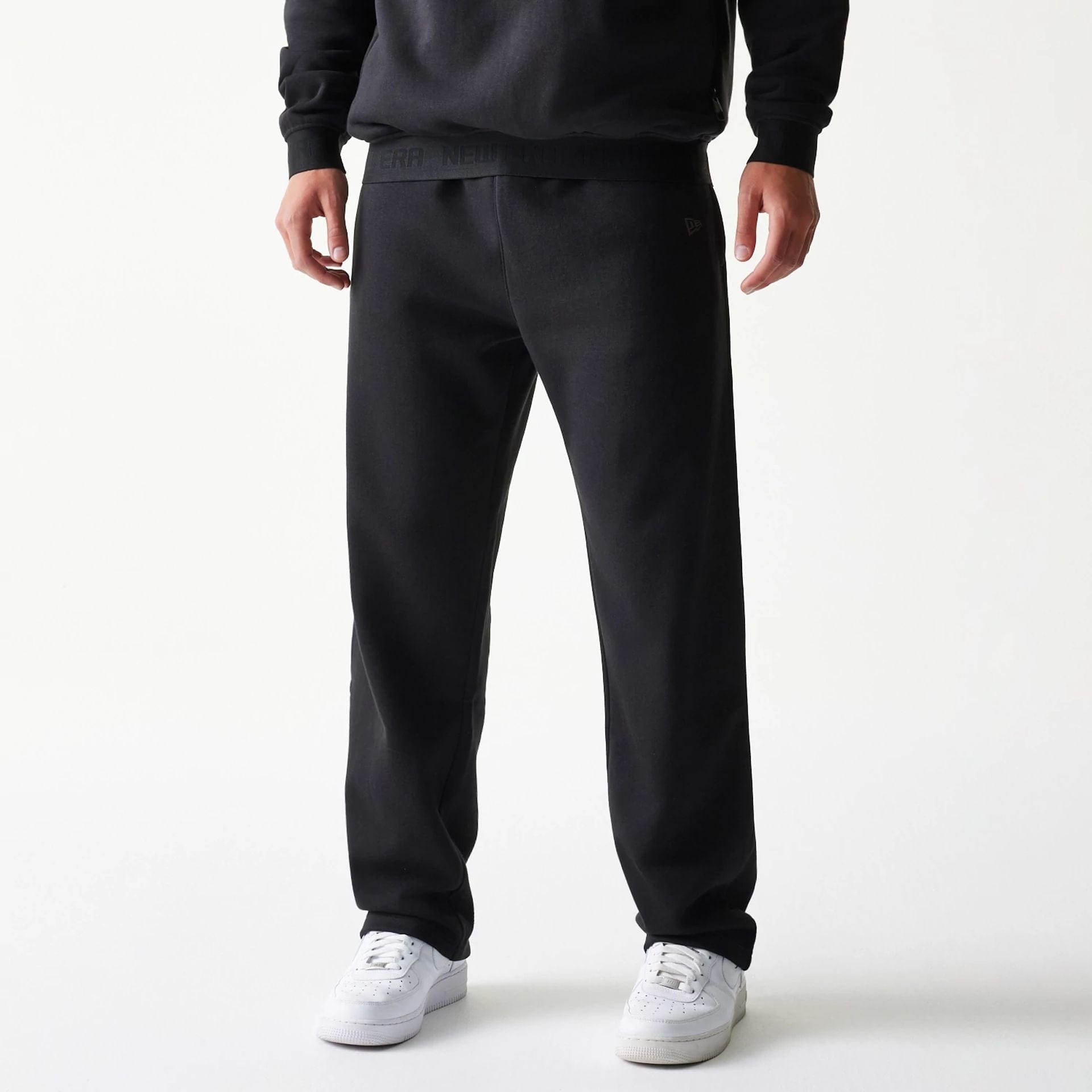 The model is wearing this New Era Tech Straight Leg Joggers in black. 4