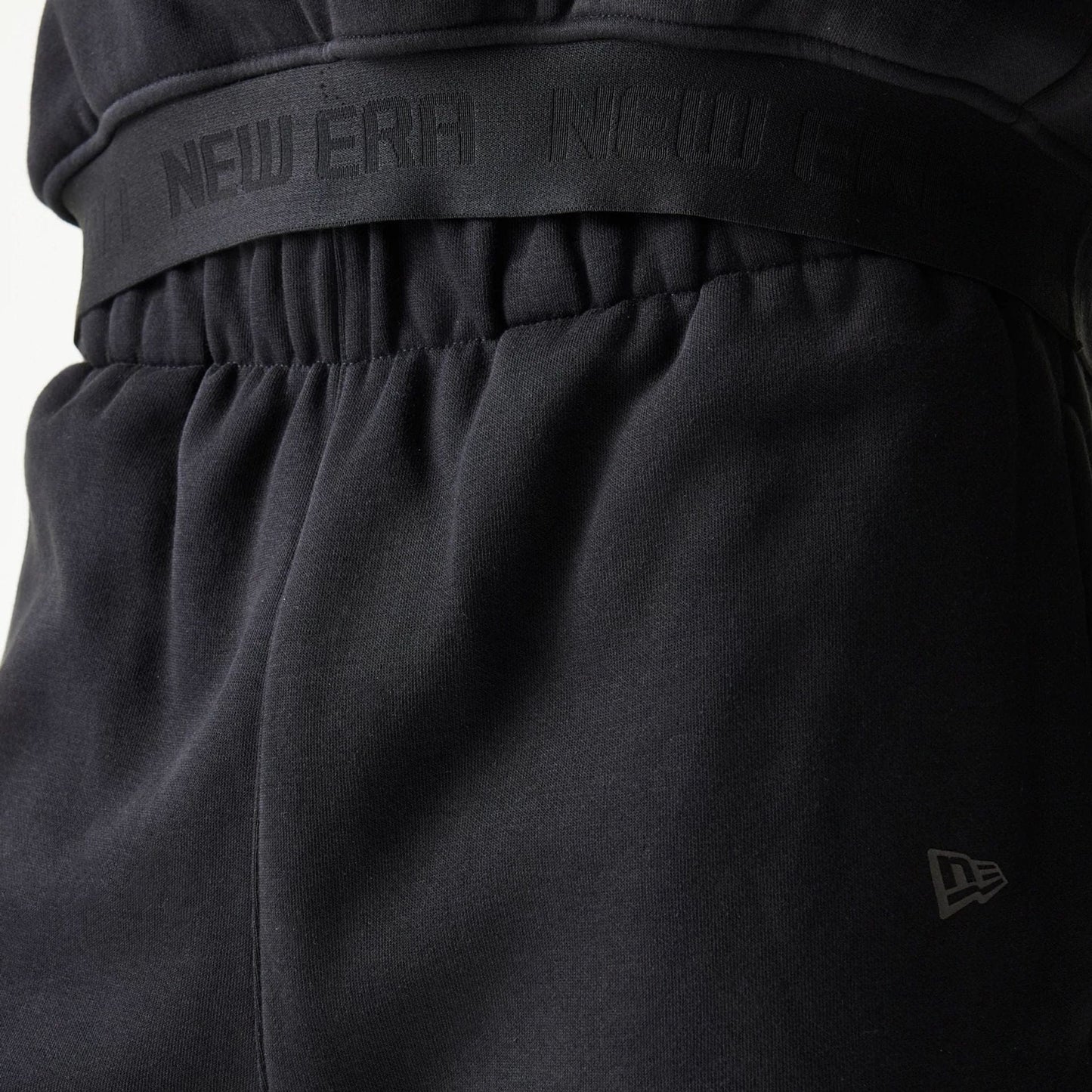 The model is wearing this New Era Tech Straight Leg Joggers in black. 6