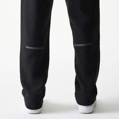 The model is wearing this New Era Tech Straight Leg Joggers in black on black. 7