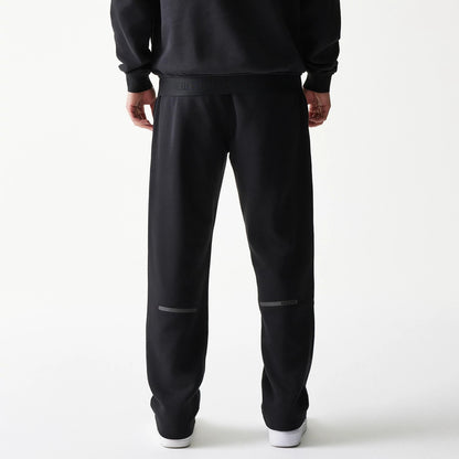 The model is wearing this New Era Tech Straight Leg Joggers in black on black. 2