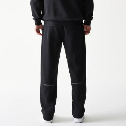 The model is wearing this New Era Tech Straight Leg Joggers in black. 2