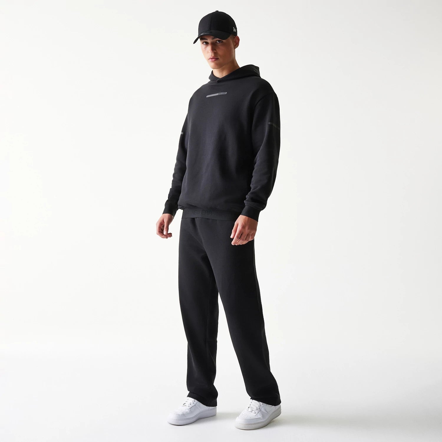 The model is wearing this New Era Tech Straight Leg Joggers in black on black. 8