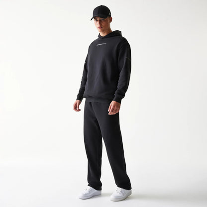 The model is wearing this New Era Tech Straight Leg Joggers in black on black. 8