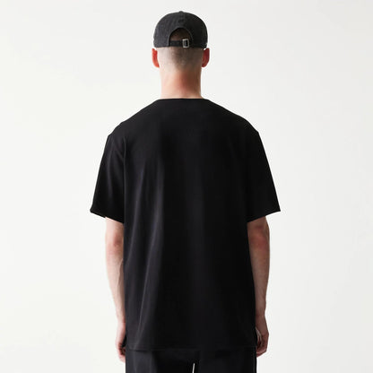 The model is wearing this New Era Script T-Shirt in black. 2