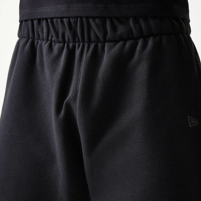 The model is wearing this New Era Tech Shorts in black. 5