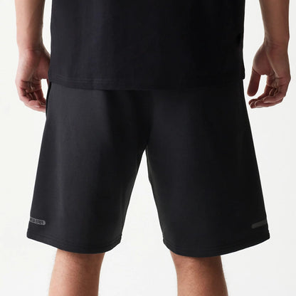 The model is wearing this New Era Tech Shorts in black. 6