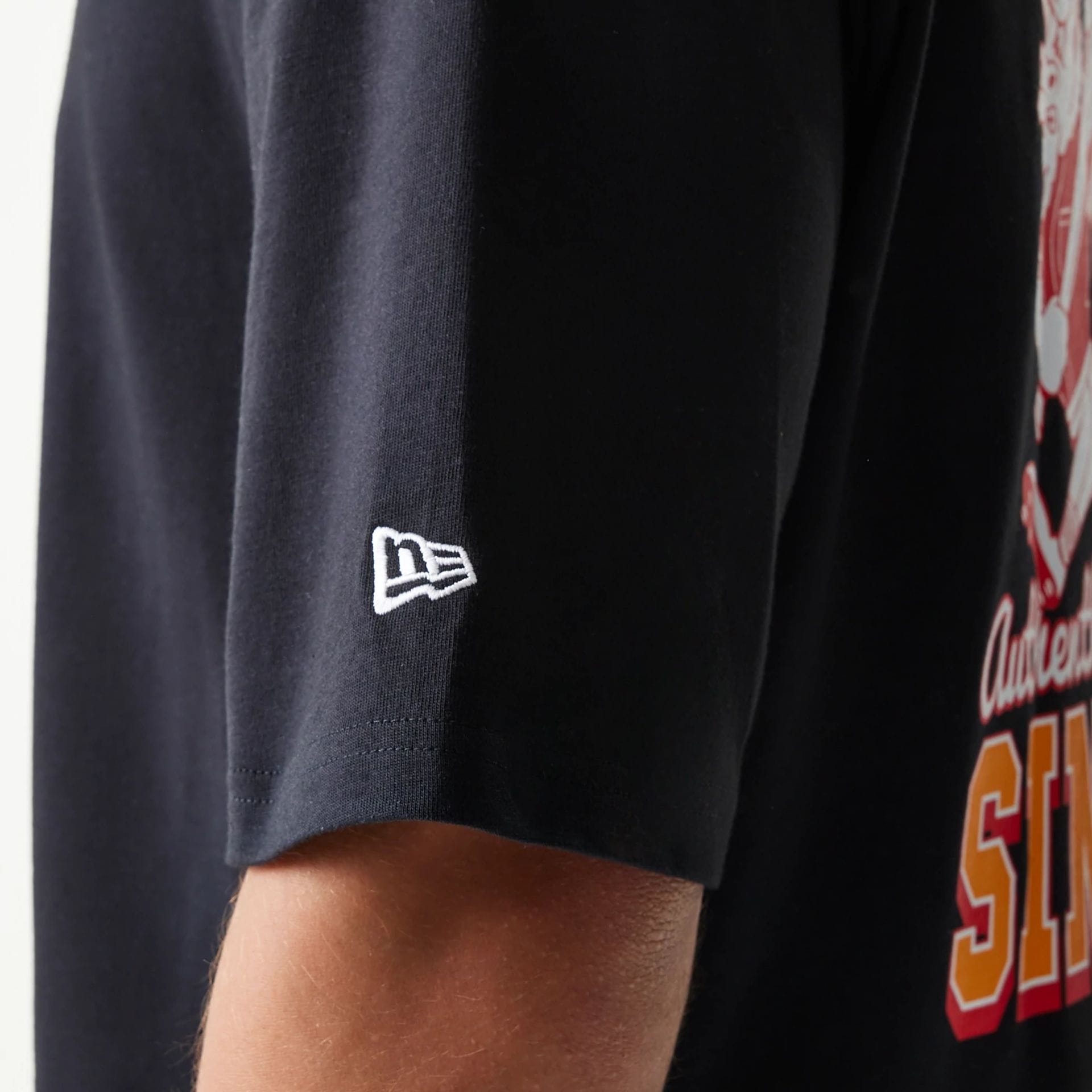 The model is wearing this New Era Baseball Cows Character Graphic Oversized T-Shirt in black. 7