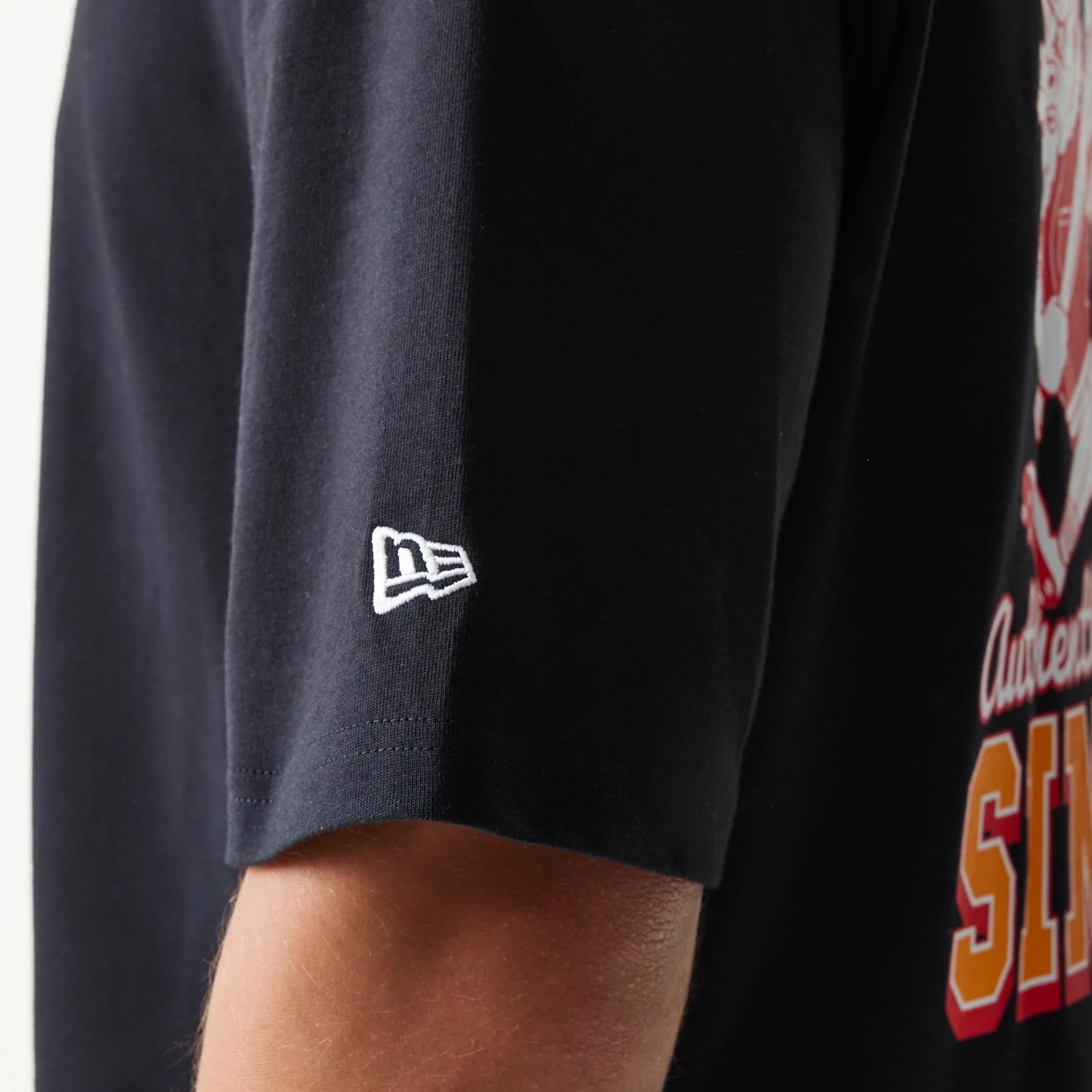 The model is wearing this New Era Baseball Cows Character Graphic Oversized T-Shirt in black. 7