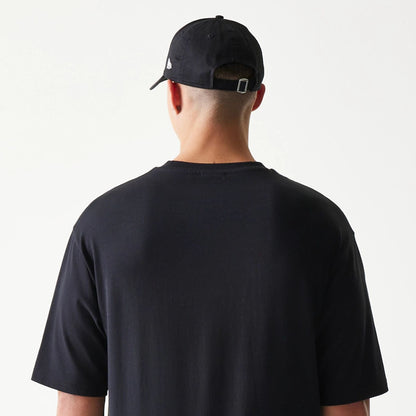 The model is wearing this New Era Lemon Fruit Graphic Oversized T-Shirt in black. 8
