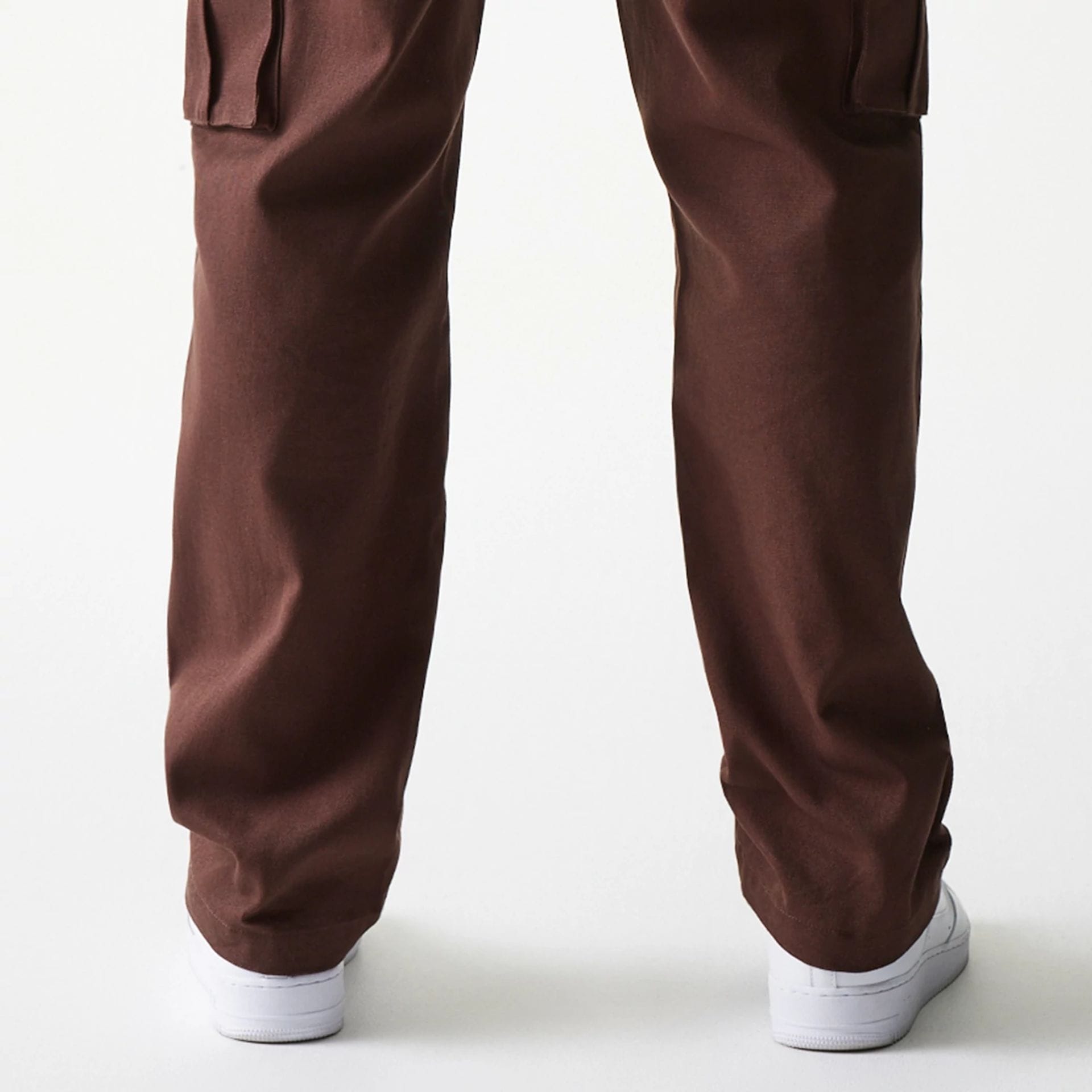 The model is wearing this New Era Straight Leg Cargo Joggers in brown. 4