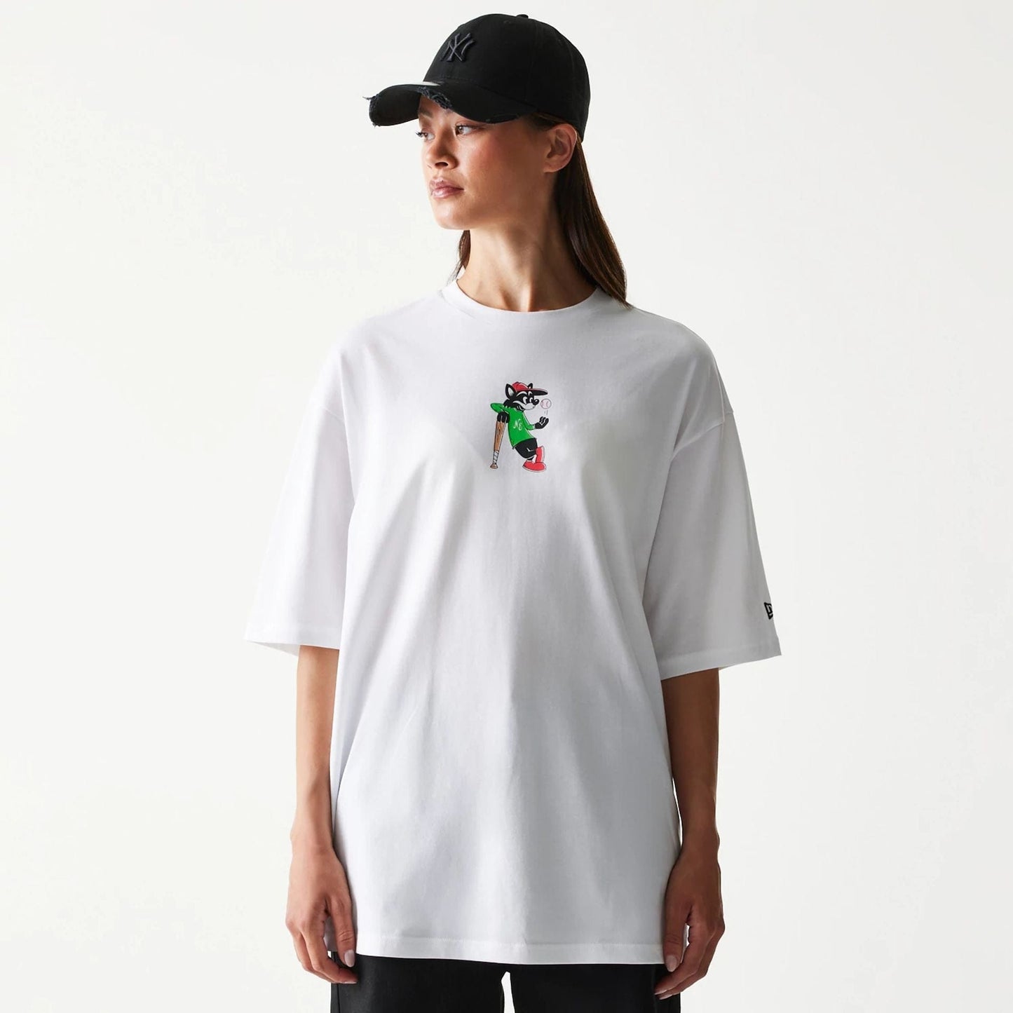 The model is wearing this New Era Baseball Cat Character Graphic Oversized T-Shirt in white. 4