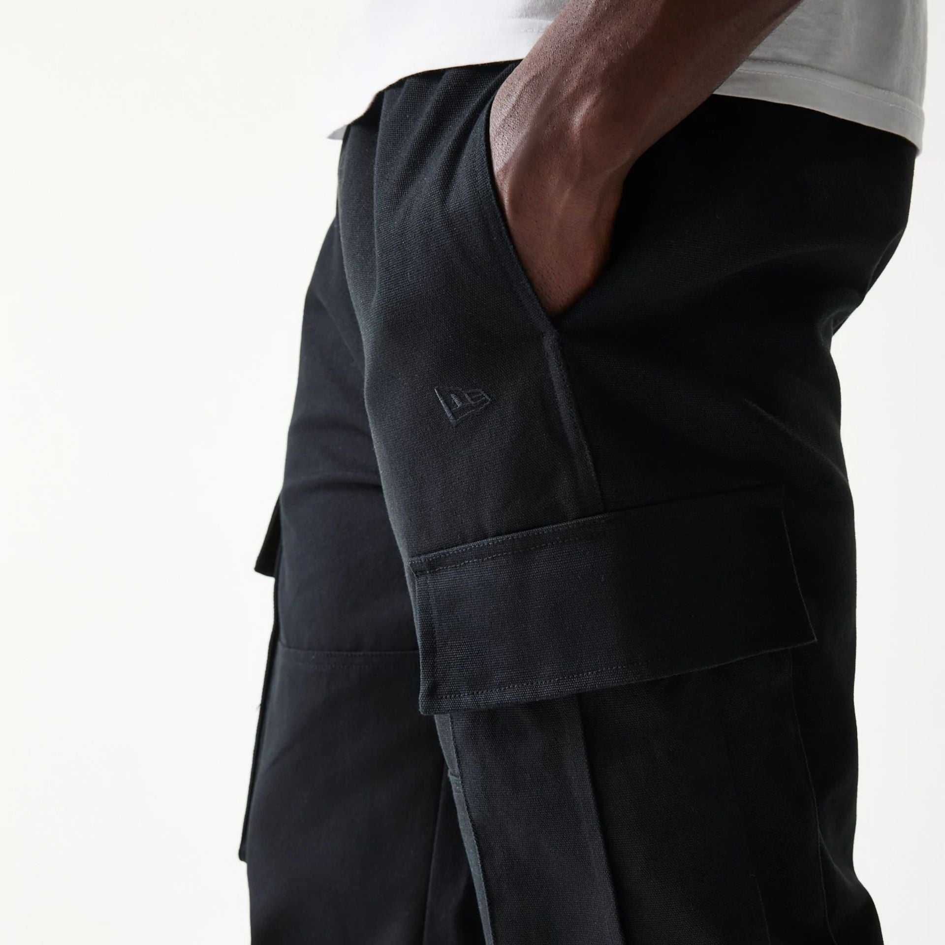 The model is wearing this New Era Straight Leg Cargo Joggers in black. 4