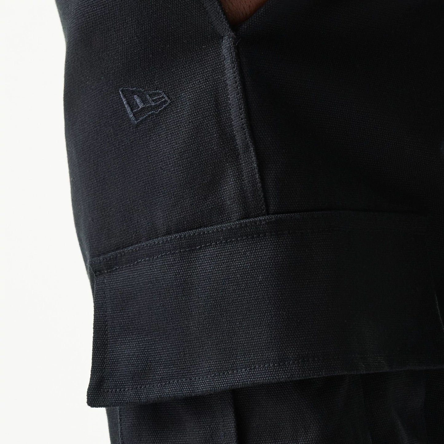 The model is wearing this New Era Straight Leg Cargo Joggers in black. 5