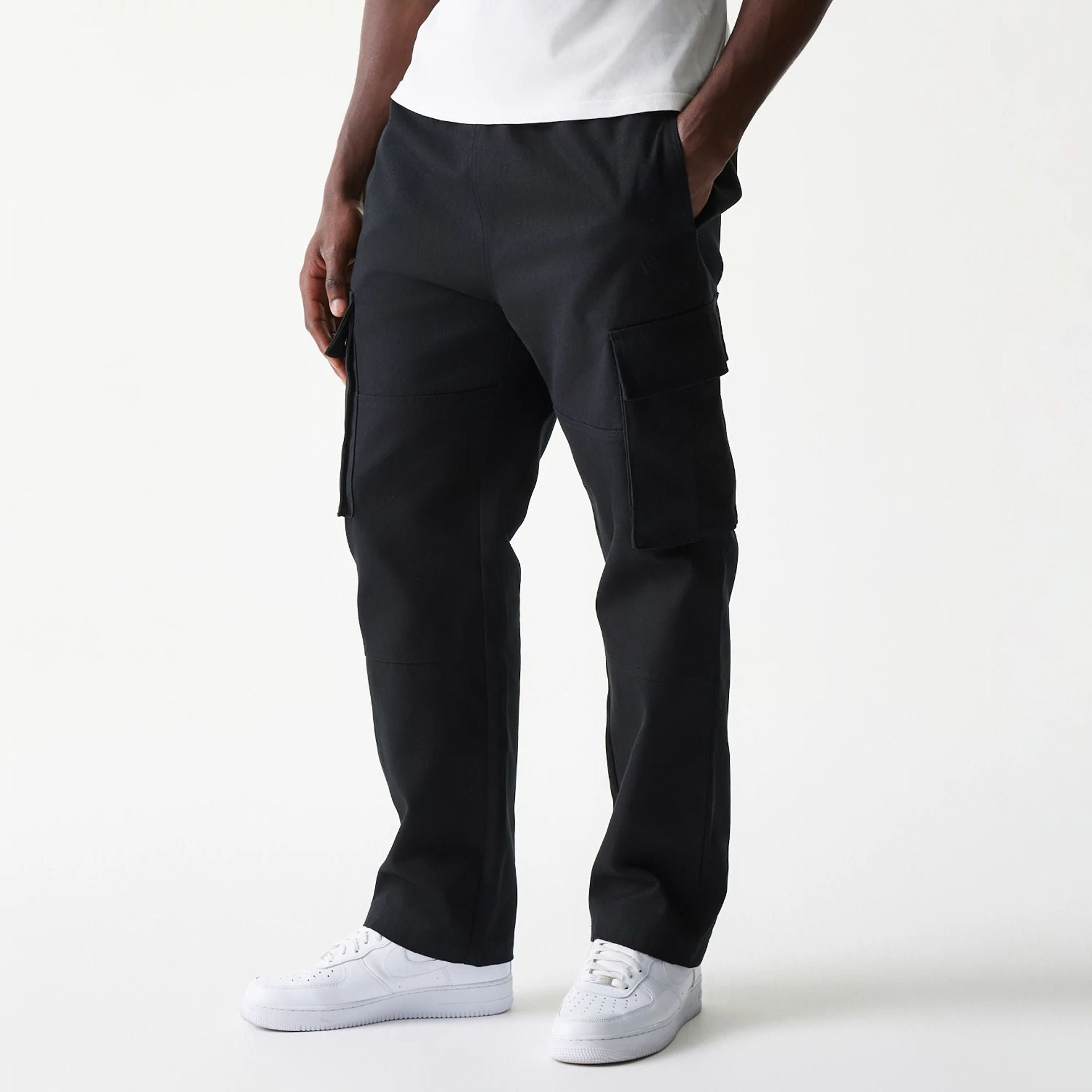The model is wearing this New Era Straight Leg Cargo Joggers in black. 1
