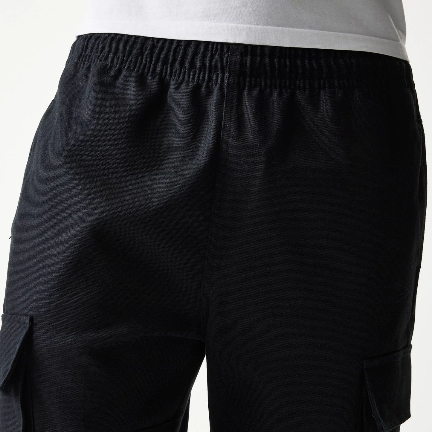 The model is wearing this New Era Straight Leg Cargo Joggers in black. 6