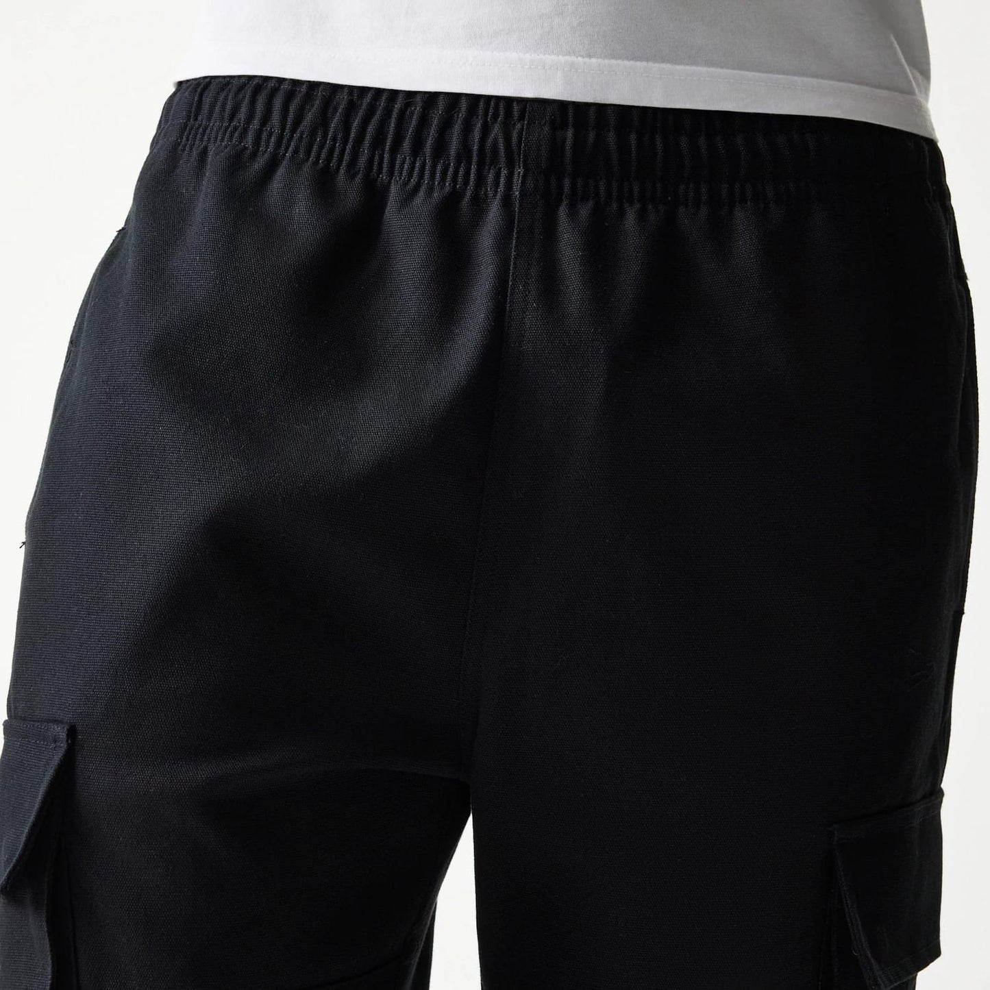 The model is wearing this New Era Straight Leg Cargo Joggers in black. 6