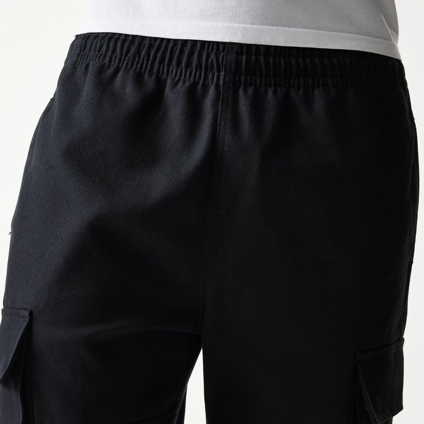 The model is wearing this New Era Straight Leg Cargo Joggers in black. 6