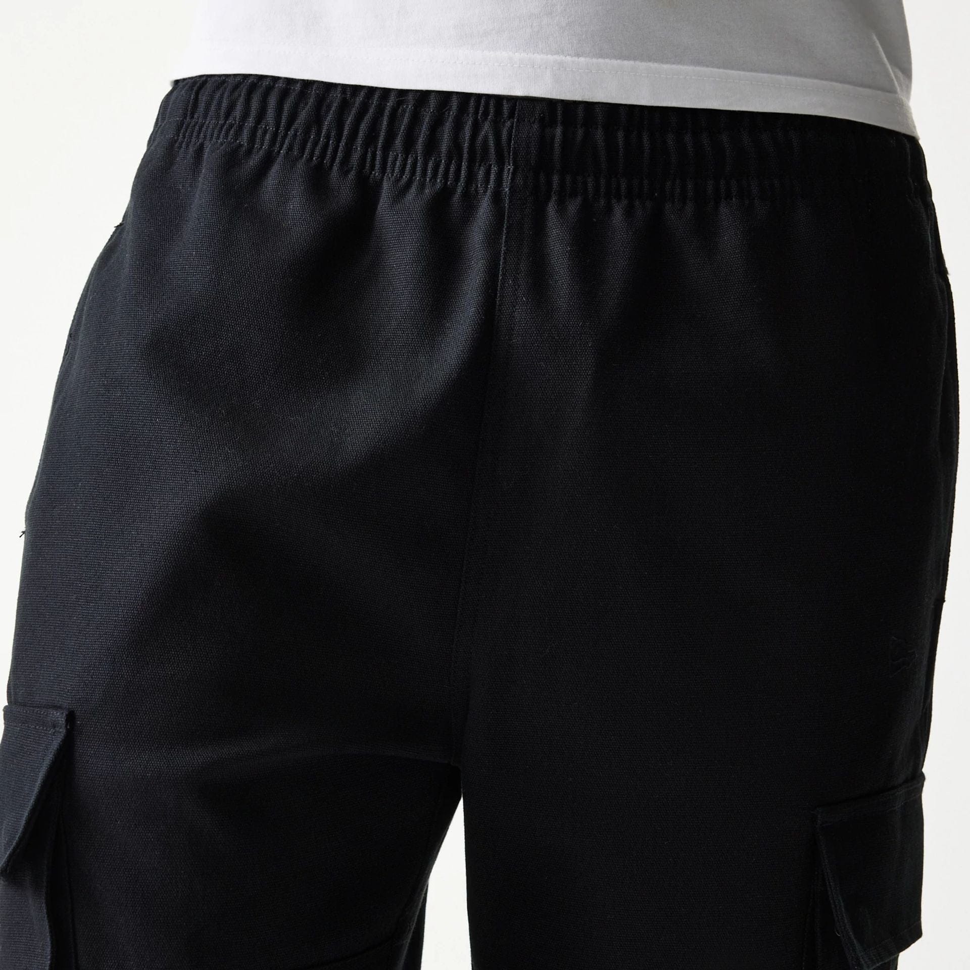 The model is wearing this New Era Straight Leg Cargo Joggers in black. 6