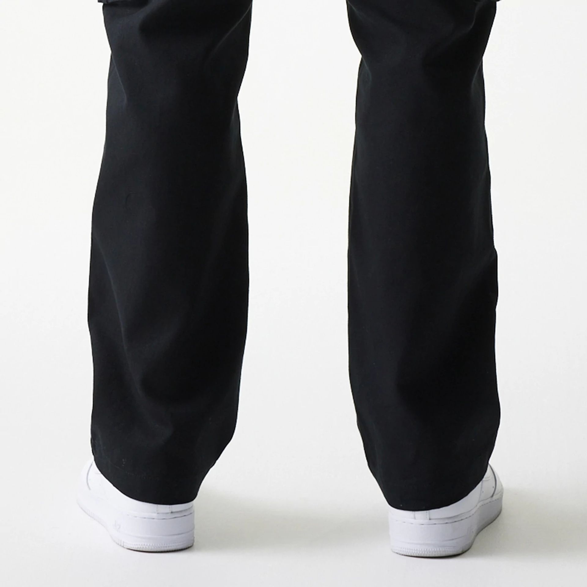 The model is wearing this New Era Straight Leg Cargo Joggers in black. 7