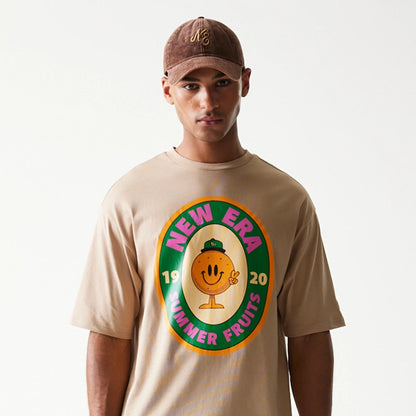 The model is wearing this New Era Orange Fruit Graphic Oversized T-Shirt in light beige. 3