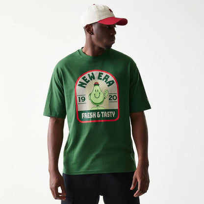 The model is wearing this New Era Pear Fruit Graphic Oversized T-Shirt in dark green. 3