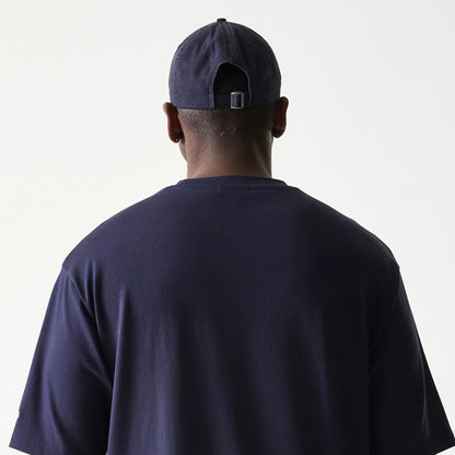The model is wearing this New Era Baseball Player Graphic Oversized T-Shirt in navy. 7