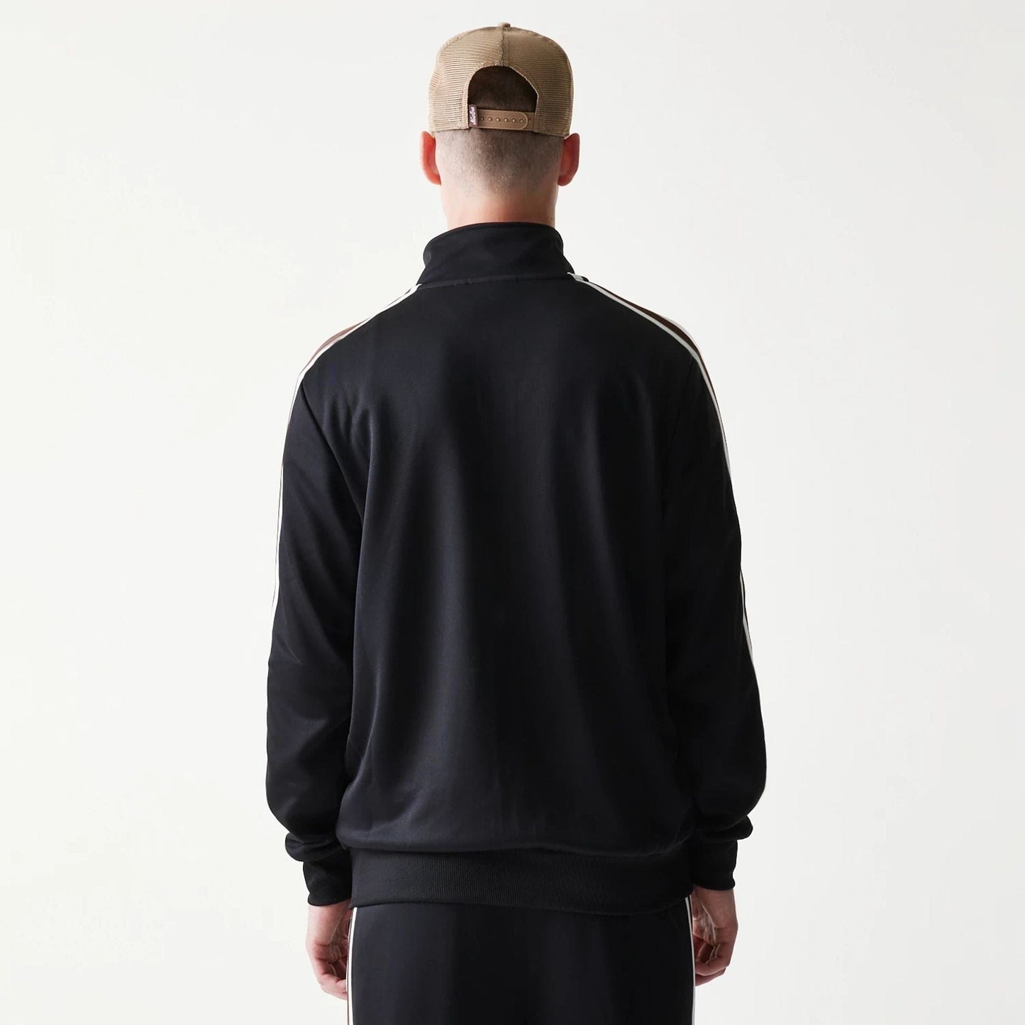 The model is wearing this New Era Script Track Jacket in black. 2