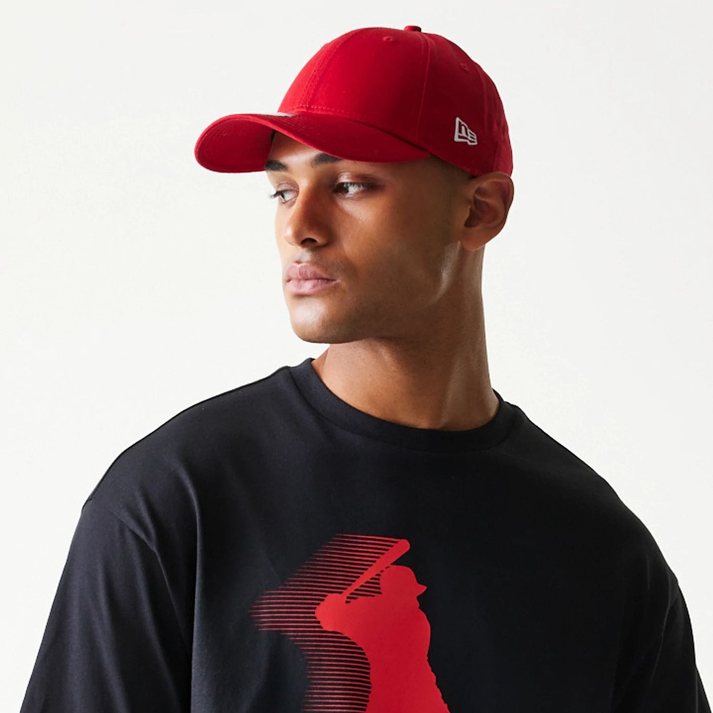 The model is wearing this New Era Baseball Player Graphic Oversized T-Shirt in black. 4