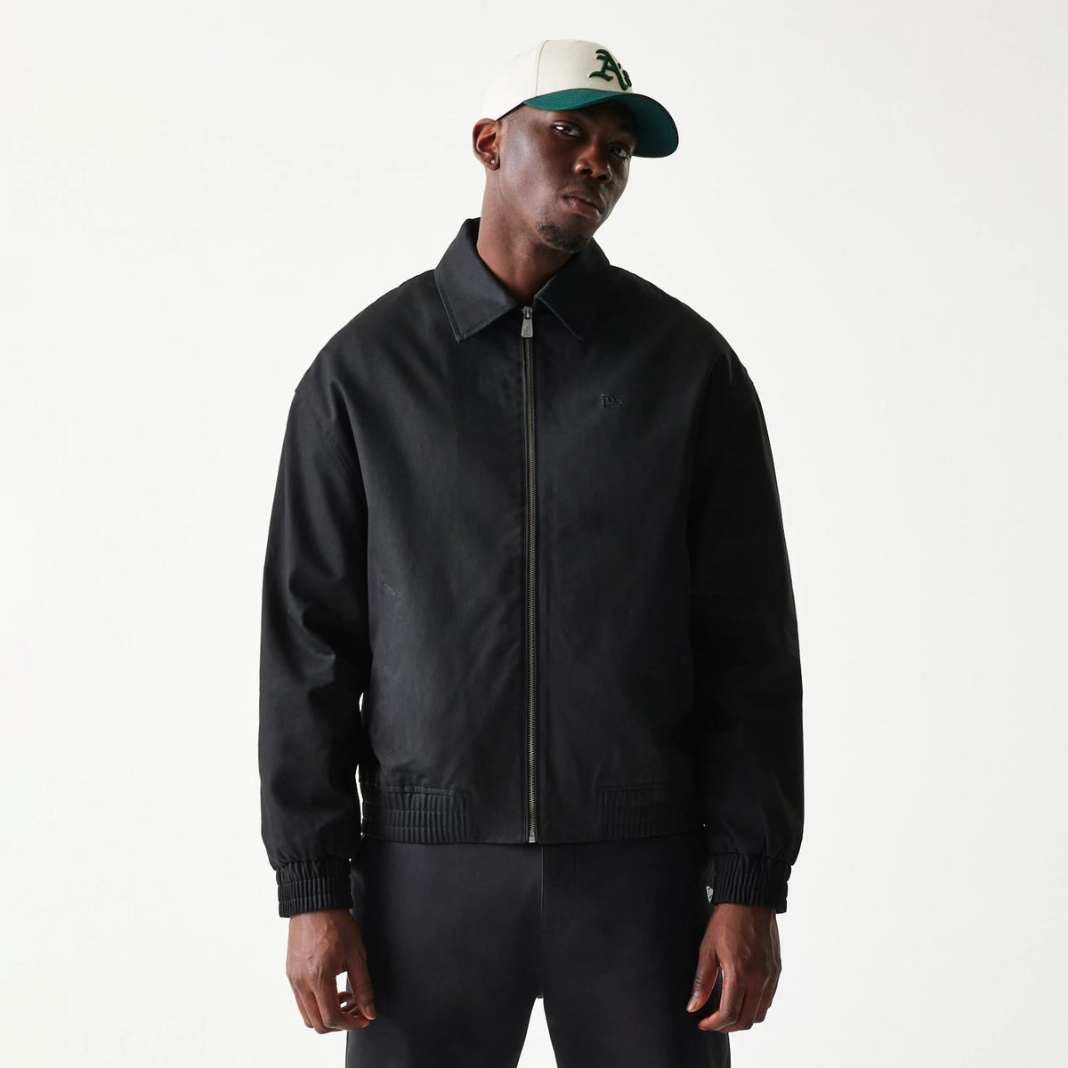 The model is wearing this New Era Collared Jacket in black. 3