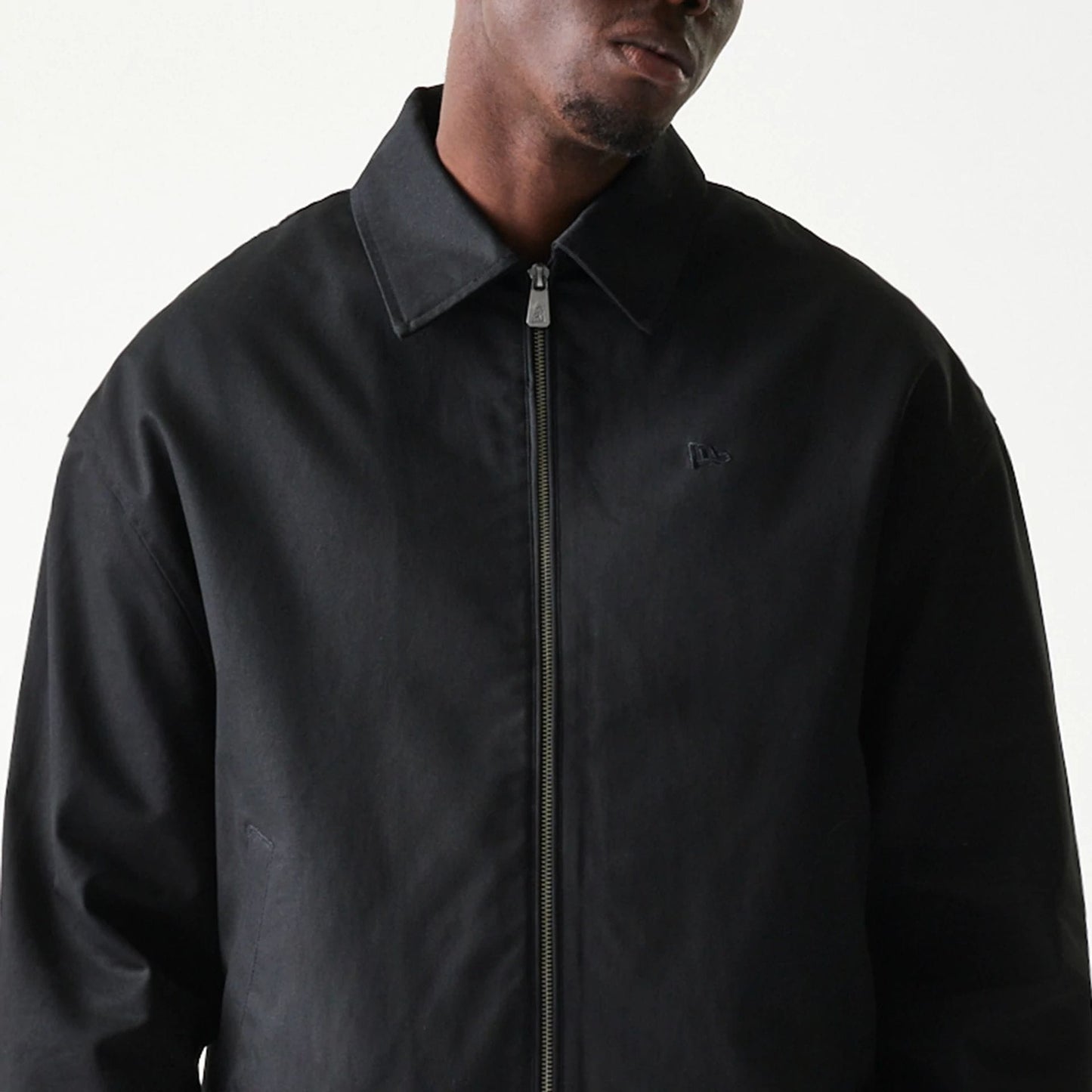 The model is wearing this New Era Collared Jacket in black. 5