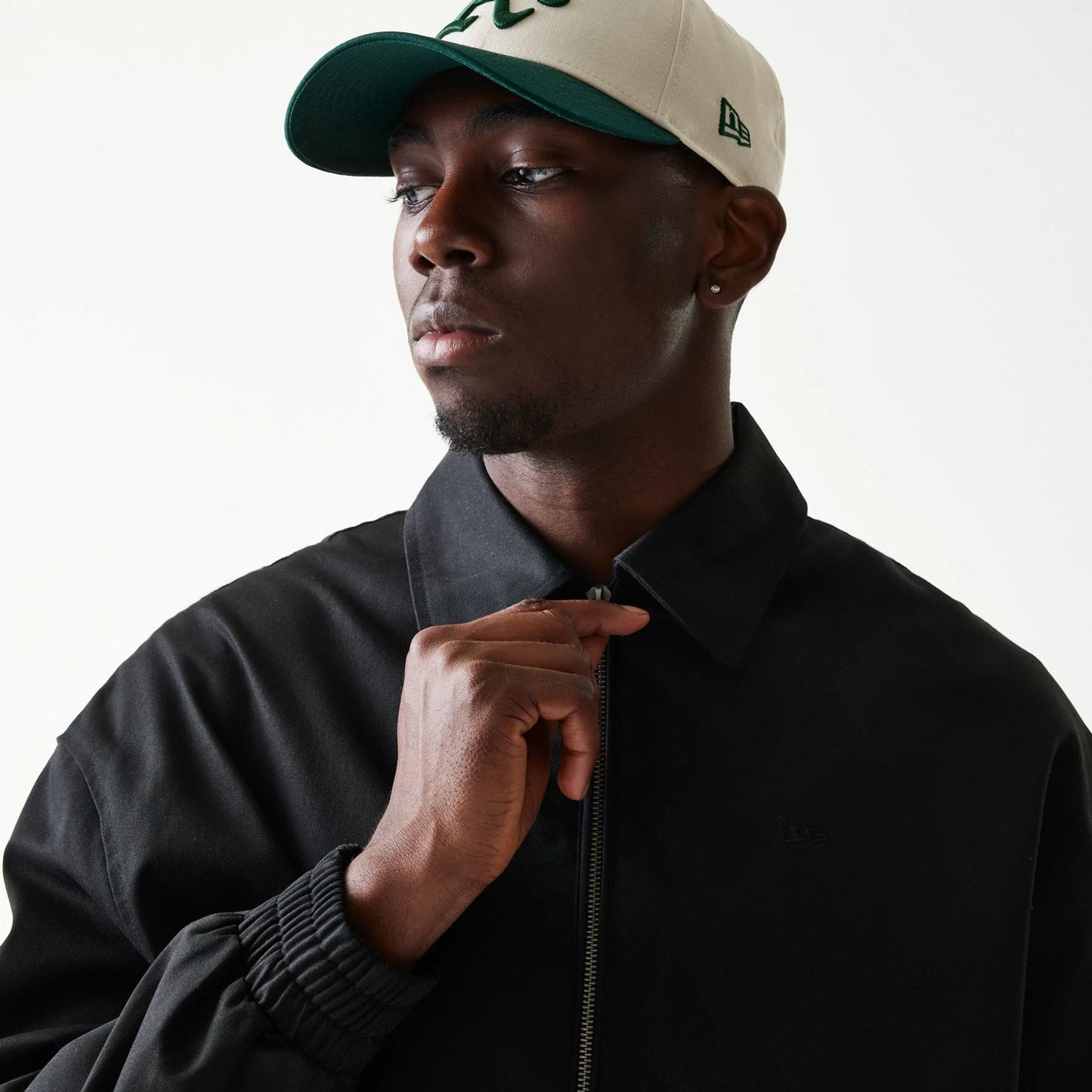 The model is wearing this New Era Collared Jacket in black. 6