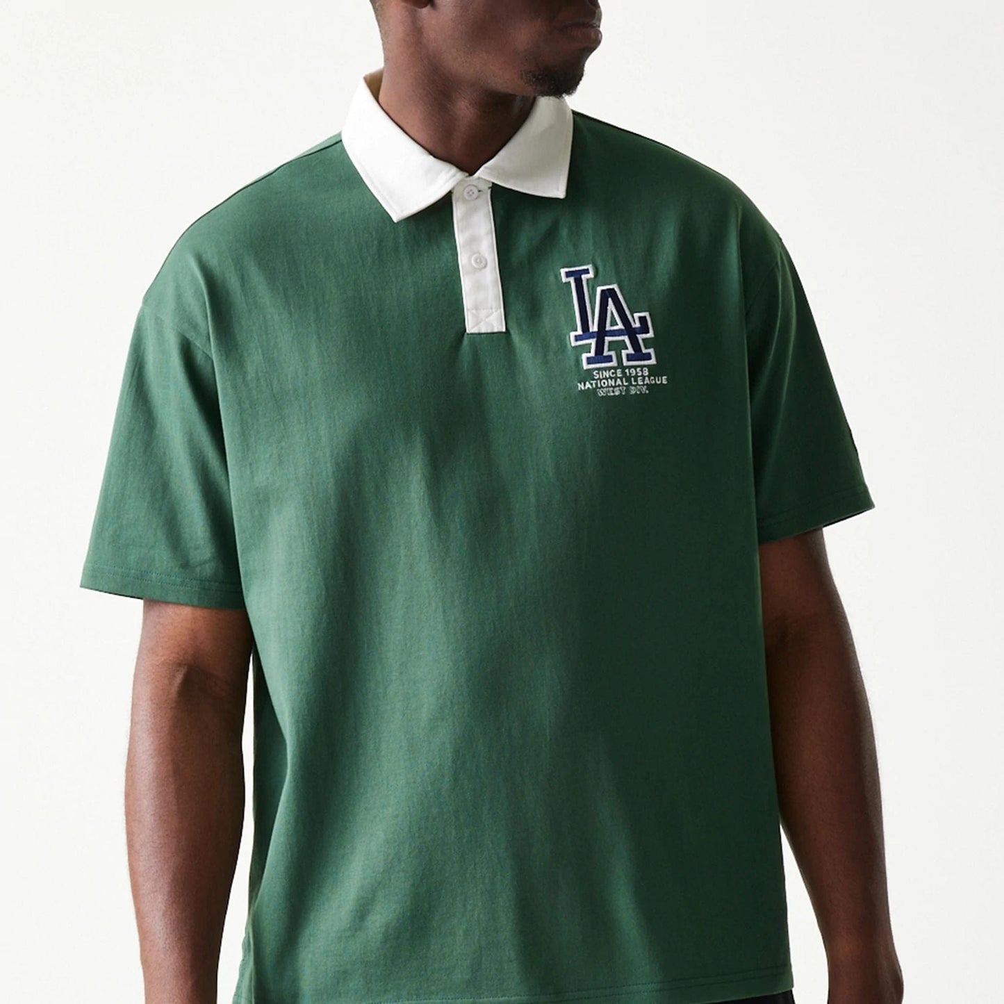 The model is wearing this MLB LA Dodgers Oversized Polo T-Shirt in dark green. 3