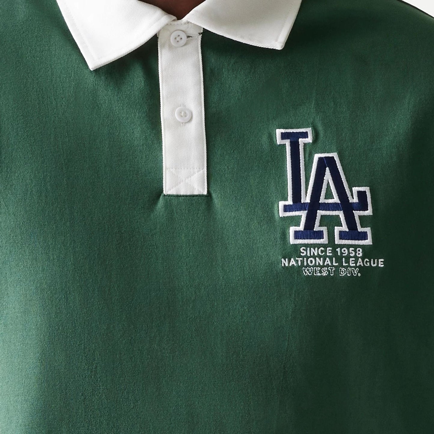The model is wearing this MLB LA Dodgers Oversized Polo T-Shirt in dark green. 4